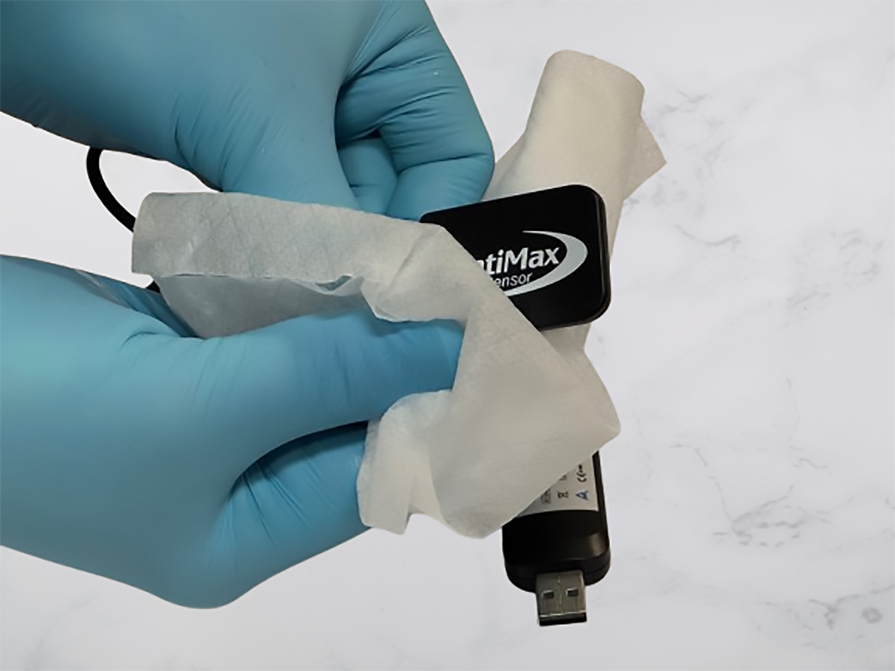 Dental sensor being cleaned gently with a soft cloth